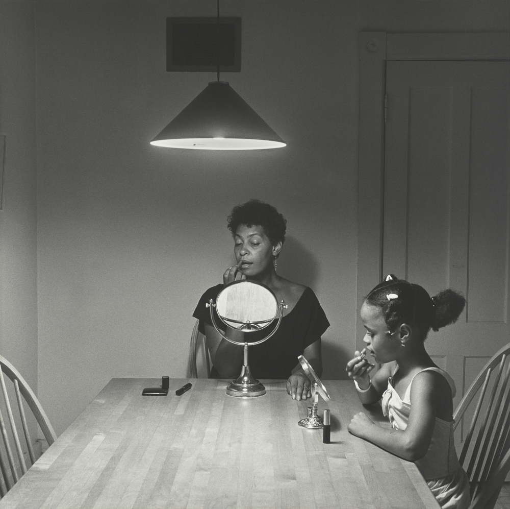 Carrie Mae Weems, “Untitled (Woman and daughter with makeup)” (1990), gelatin silver print, 27 3/16 × 27 3/16 inches © 2021 Carrie Mae Weems.